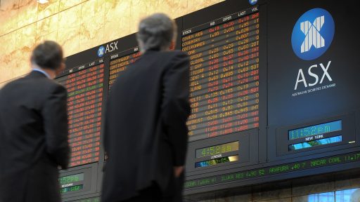 Two men walk past the Australian Stock Exchange